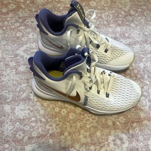 Nike White Sneakers with Gold Swoosh and Purple Lining